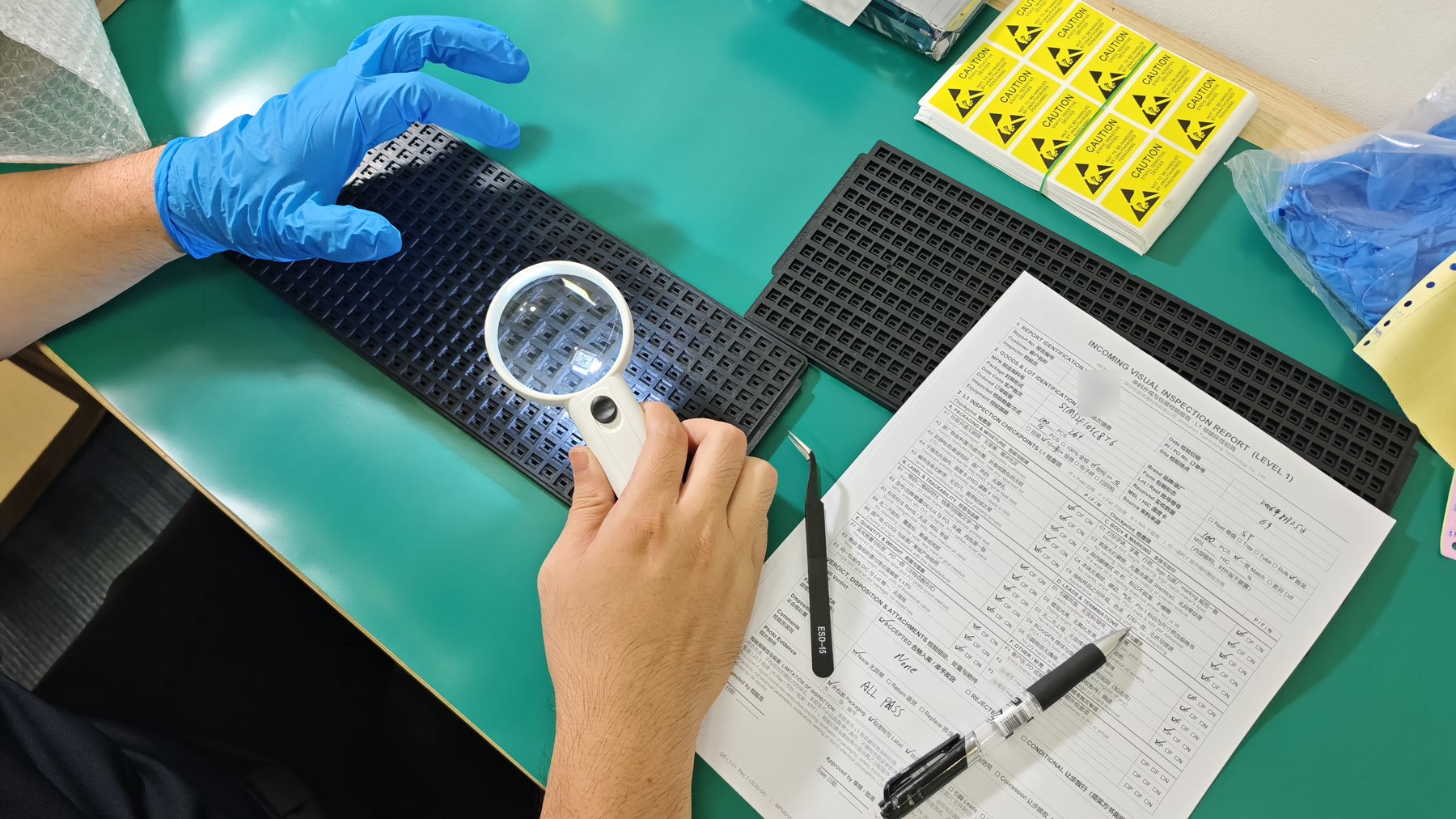 Incoming Level 1 visual inspection in Shenzhen: components on an ESD tray examined under a magnifier beside a written report.