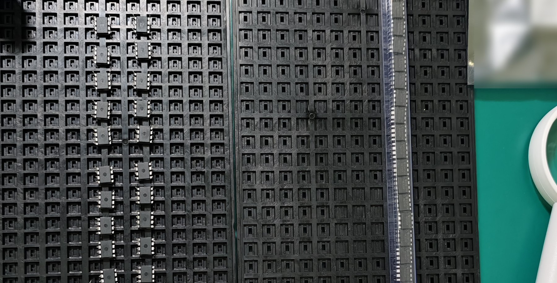 Component carrier forms on the receiving bench: waffle trays, tubes and cut tape.